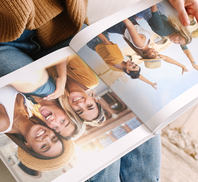 Open photobook featuring photos of parents playing with their children
