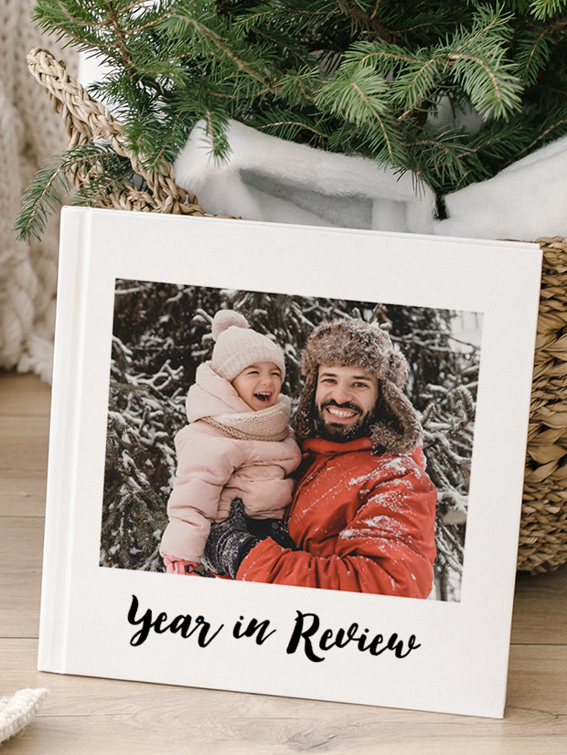 Cover of a photobook of a father and child camping with the text 'Adventures with Daddy' on the front